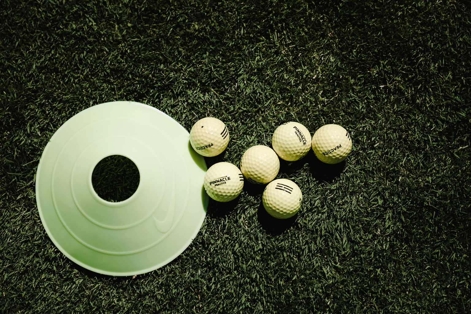 Practice hole with golf balls